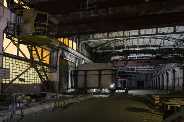 istock Old broken empty abandoned industrial building interior at night 1193164007