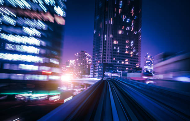 istock Futuristic High Speed Light Tail with Night City Background 1193164024