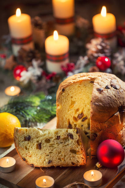 istock Delicious panettone on christmas table wit decorations and advent wreath and candles 1193166531