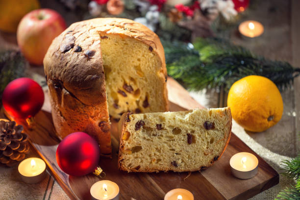 istock Delicious panettone on christmas table wit decorations and advent wreath and candles 1193166534