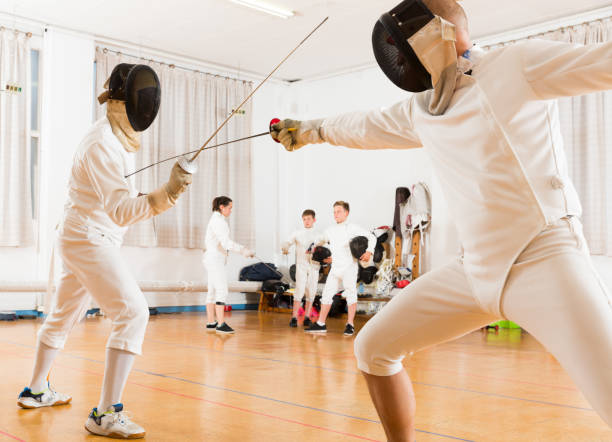 istock fencing duel  of two professional trainers 1193167698