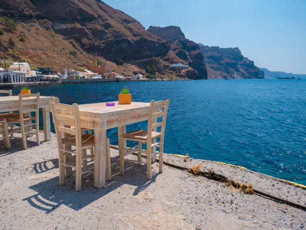 istock Small table on the shore in Santorini 1193169194