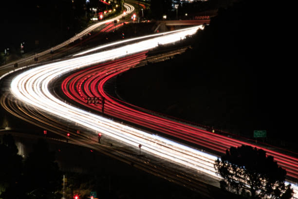 Time lapse of traffic on 405 freeway in Sepulveda pass from side street Time lapse of traffic on 405 freeway in Sepulveda pass from side street highway 405 photos stock pictures, royalty-free photos & images