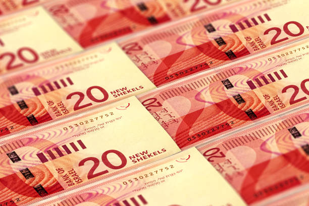 istock ILS. Israeli shekels background. 20 shekels pattern. 1193172201