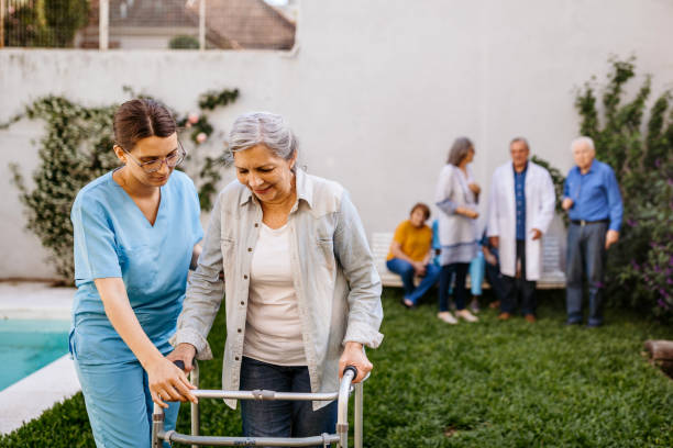 istock Nurse assisting senior woman with mobility walker 1193173439