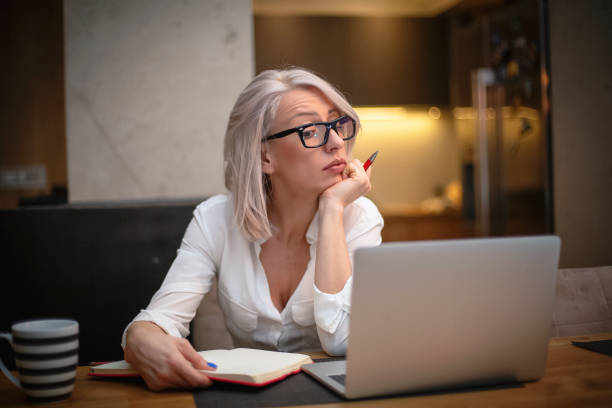 istock Woman working form home late at night 1193174930