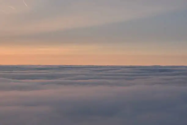 Photo of Horizon ocean of clouds in the sky at dusk after sunset