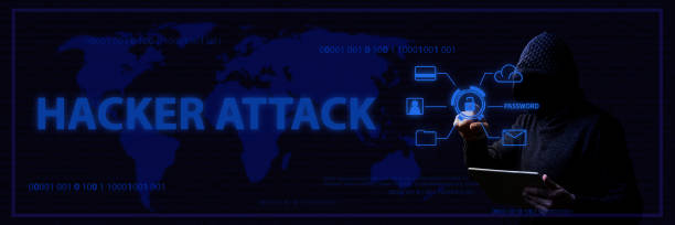istock Concept of hacker attacks and data theft with a faceless man in a hood and blue lighting 1193175901