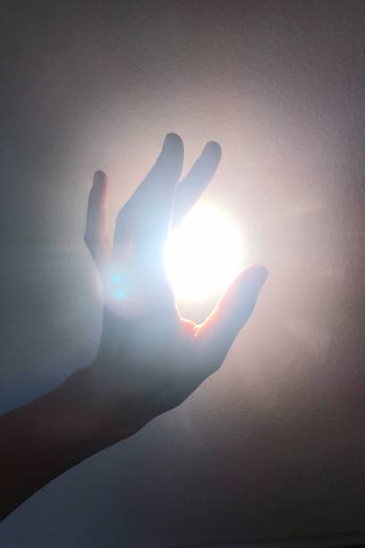 istock hand reaches for the light 1193186218