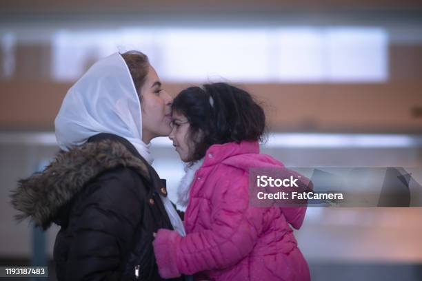 Muslim Mother And Daughter In The Airport Stock Photo Stock Photo - Download Image Now