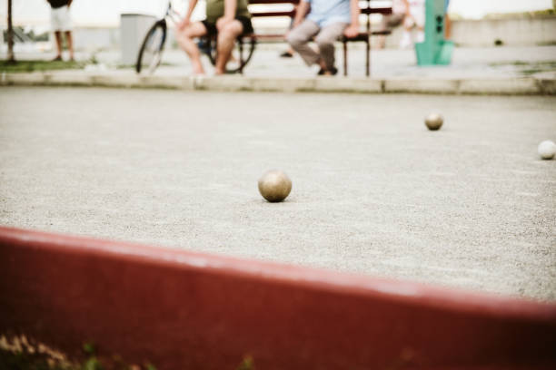 istock Old mens playing petanque in a city park. 1193187883
