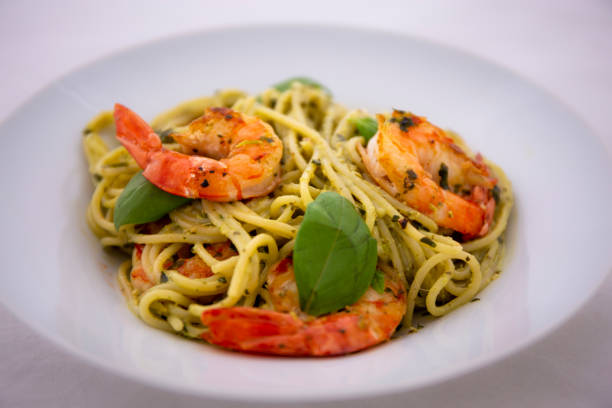 istock Spaghetti with prawns and pesto sauce 1193192378