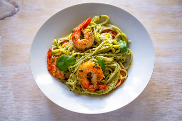 istock Spaghetti with prawns and pesto sauce 1193192400