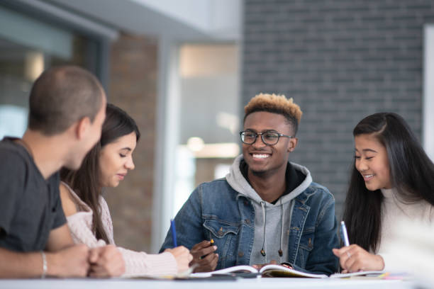 istock University Students Sharing Ideas stock photo 1193192530