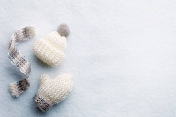 Knitted scarf,hat and gloves with white copy space