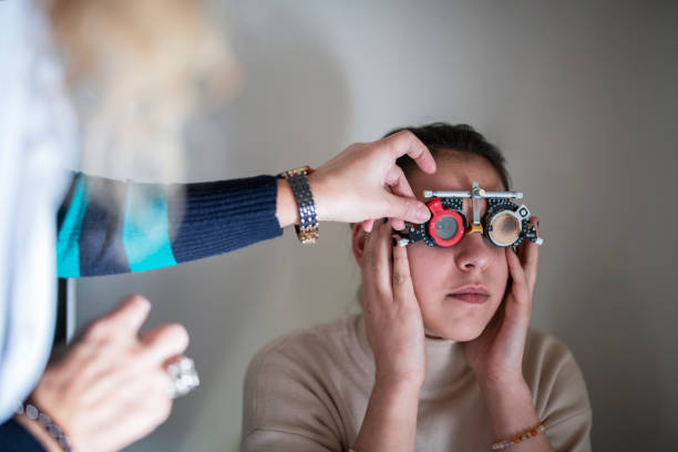 istock Female patient having eye tested in hospital 1193198769