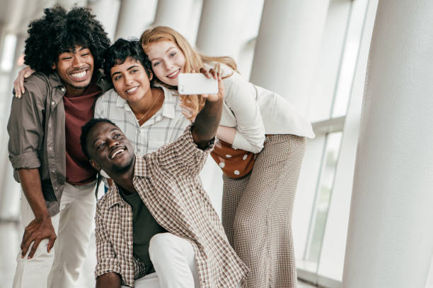 istock Group of students posing for photos 1193199316