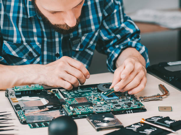 istock electronics repair shop disassembled laptop 1193199463