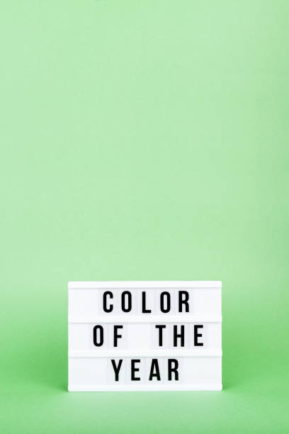 istock Retro lightbox with Color of the year wording on the trendy solid green backdrop in vertical format 1193199521