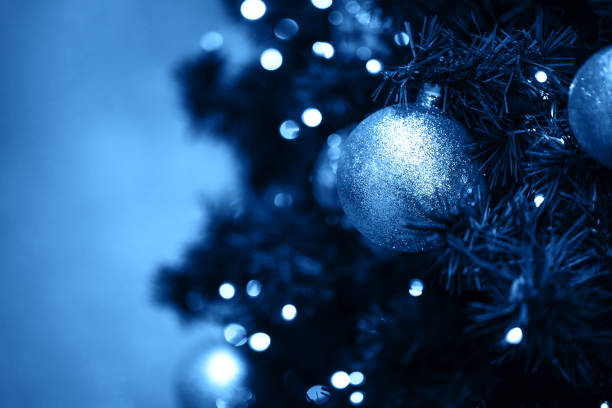 istock Fir branch with balls and festive lights 1193200161