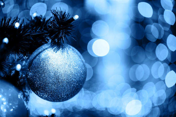 istock Fir branch with balls and festive lights 1193200169