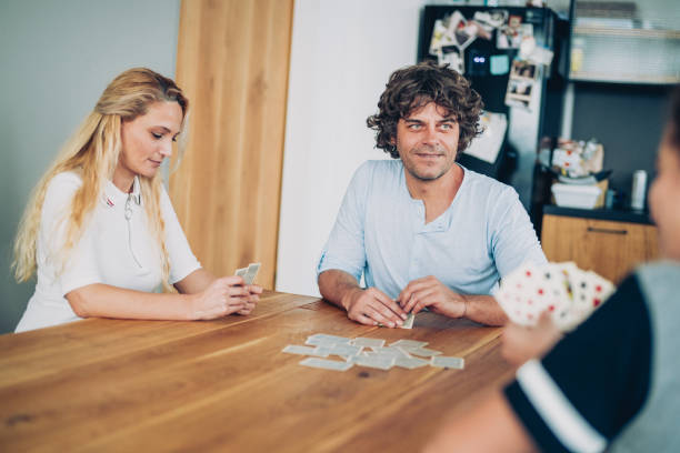 istock Cheerful Family Playing Cards 1193206346