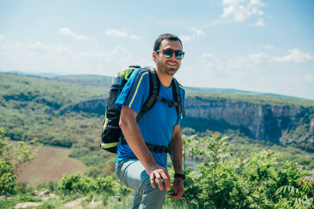 istock Smiling male hiker in the mountain 1193206436