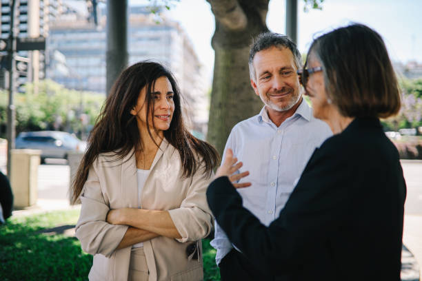 istock Friends talking on street after work 1193207895