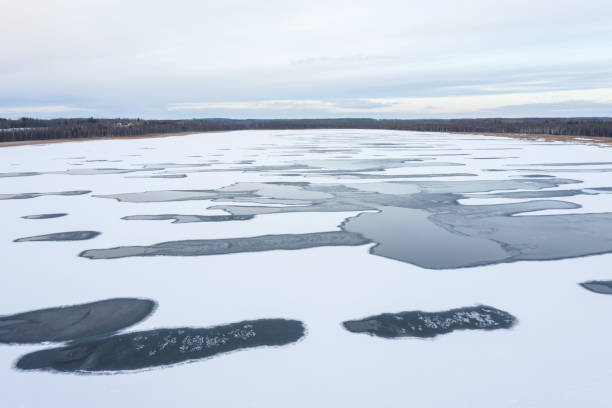 istock Frozen lake with unfrozen patches. 1193212695
