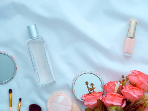 istock Roses flowers keyboard makeup tools and brushes on white linen 1193212800