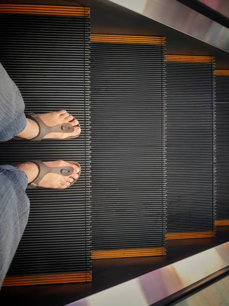 istock Standing on the escalator floor with copy space 1193212883
