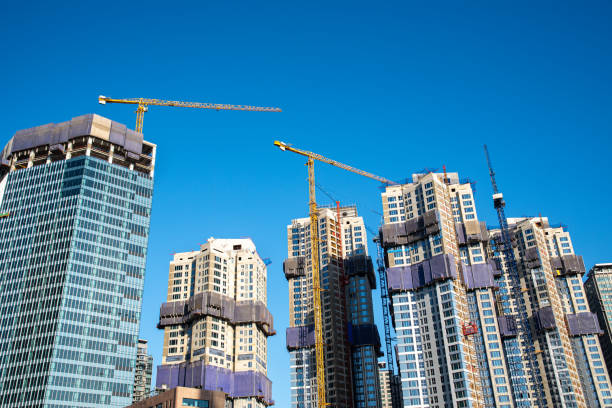 istock Modern skyscrapers under construction with tower cranes. Industry concept. 1193216548
