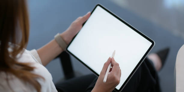 istock Cropped shot of businesswoman working on her project with blank screen digital tablet 1193216632