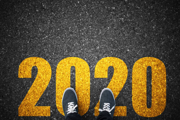 istock New year 2020 text on asphalt walking direction on asphalt 1193218282