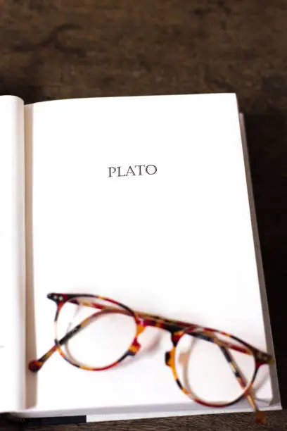Photo of Open Book, Title Page: PLATO (With Tortoise Shell Eyeglasses)