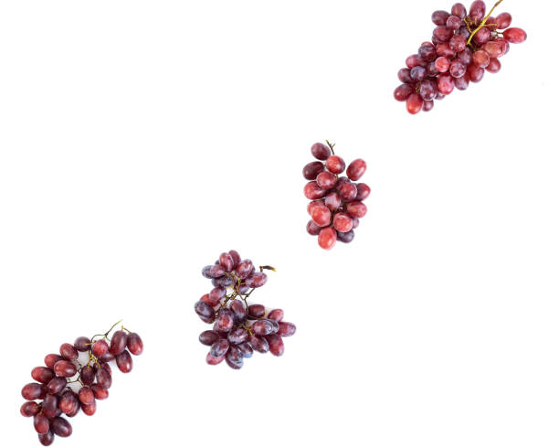 istock Bunch of fresh ripe juicy red grape flat lay on white 1193229552