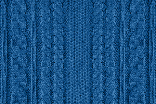 Blue knitted wool texture can use as background.Blue trend color 2020 year
