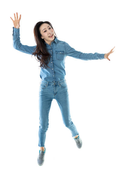 Happy woman jumping on white background.