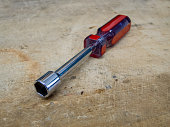 Red and blue nut driver hand tool