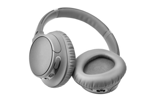 istock Gray wireless headphones on white background isolated close up, grey bluetooth headset with big leather ear pad cushions design, modern black wi-fi stereo sound earphones side view, audio music device 1193238064