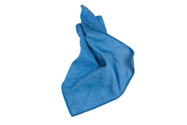 孤立した白い背景にほこりを拭くために青いぼろ。 - domestic kitchen towel dish cloth rag ストックフォトと画像