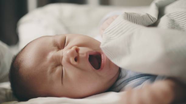 istock Newborn Baby Yawning 1193245669