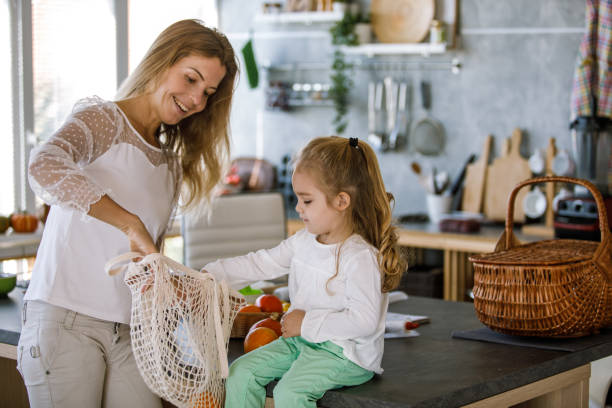 Helping her mother unpack the groceries