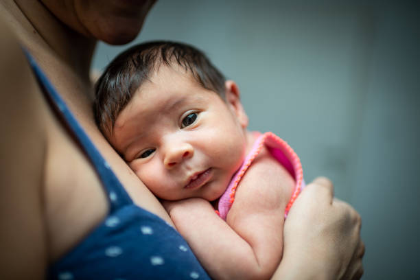 istock Mother holding newborn baby 1193248446