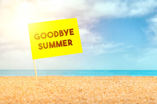 istock Post it with goodbye summer words, it stands on the sand at the beach 1193248487