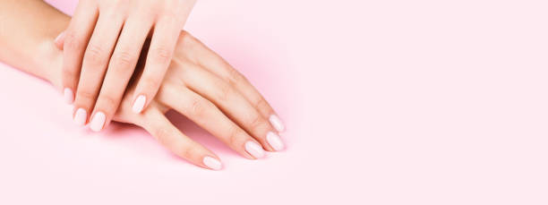istock Female's hands with classic pastel manicure. 1193249263
