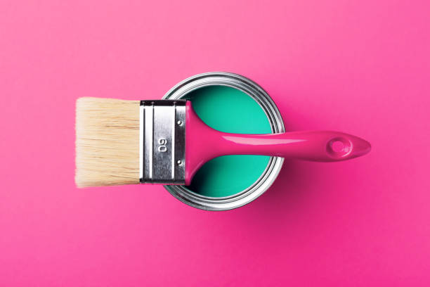 istock Can of turquoise paint on pink. 1193249541