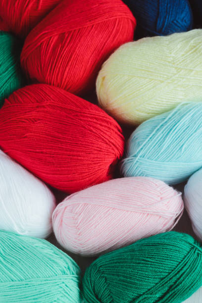 istock colorful oval acrylic colorful wool yarn thread skeins background 1193250287