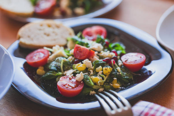istock Field salad - corn salad with soft cheese, sweetcorn, pomegranate and cherry tomatoes 1193250358