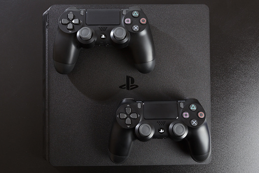 Russia, OKTOBER 24 2019: The new Sony Dualshock 4 with PlayStation 4. Sony PlayStation 4 game console of the eighth generation.
